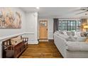 Cozy living room with wood floors, neutral paint, bench and a view to the outside at 2867 Dresden Way, Atlanta, GA 30341