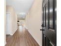 Inviting entryway features beautiful laminate wood flooring, neutral walls, and leads to the living areas at 11181 Wind Ridge Dr, Hampton, GA 30228