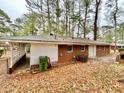 The backyard of this home has mature trees and a covered area at 1905 Fort Valley Sw Dr, Atlanta, GA 30311