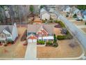 Aerial view of a brick two-story home showcasing its location and manicured lawn at 243 Wedmore Ct, Suwanee, GA 30024