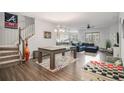 Inviting living room with a staircase, and view into the open-plan kitchen at 24 Aspen Way, Dallas, GA 30157