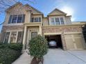 Beautiful home with stone accents, attached garage, and manicured landscaping creating an inviting curb appeal at 3740 Crowchild Dr, Cumming, GA 30041