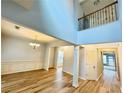 Bright living room with hardwood floors, wainscoting, and high ceilings at 3740 Crowchild Dr, Cumming, GA 30041