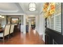 Inviting foyer with hardwood floors, complemented by elegant decor and natural light at 2279 Larkspur Run Dr, Duluth, GA 30097