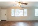 Bright living room with multiple windows and wood-look flooring, providing an inviting atmosphere at 1440 Kenilworth Sw Dr, Atlanta, GA 30310