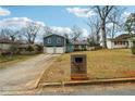 A lovely two-story home featuring a well-kept lawn and a driveway leading to a two-car garage at 2235 Emerald Springs Dr, Decatur, GA 30035