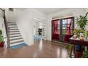 This foyer boasts hardwood floors, a staircase and an office at 4205 Madison Hall Dr, Cumming, GA 30028