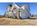 Beautiful two-story home with a two car garage and manicured landscaping at 4205 Madison Hall Dr, Cumming, GA 30028