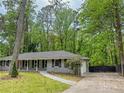 Well-kept single story home featuring a walkway to the entrance and a driveway leading to the garage at 2899 Tejas Sw Trl, Atlanta, GA 30331
