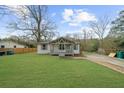 Well-maintained single-story home with a spacious front yard and traditional design elements at 2923 Hall Se Dr, Smyrna, GA 30082