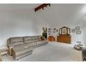 Spacious living room with a large leather sofa and traditional wooden dresser at 3852 Old Bridge Way, Duluth, GA 30096