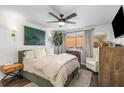 Tranquil bedroom featuring a queen-sized bed, ceiling fan, and ensuite bath at 100 Biscayne Nw Dr # E1, Atlanta, GA 30309