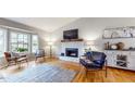 Bright living room featuring hardwood floors, a fireplace, and comfortable seating arrangements at 2336 Vistamont Dr, Decatur, GA 30033