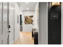 Entry hall featuring unit number 1503, hardwood floors, and modern decor at 40 12Th Ne St # 1503, Atlanta, GA 30309