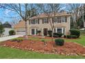 Well-maintained two-story home with a manicured front lawn and a welcoming facade at 1429 Christiana Dr, Lawrenceville, GA 30043
