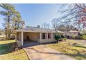 Cozy single-Gathering home with a covered front porch, a well-kept lawn, and ample parking space at 3517 Hyland Dr, Decatur, GA 30032