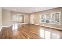 Bright living room featuring hardwood floors, neutral walls, and an arched entrance at 958 Winburn Dr, East Point, GA 30344