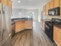 Well-equipped kitchen featuring stainless steel appliances, modern countertops, and plenty of storage at 5132 Silhouette Sw Ln, Mableton, GA 30126