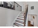 Elegant staircase with decorative railing leading to the dining area at 3374 Grey St, Duluth, GA 30096