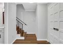 Entryway with wooden staircase and door to outside at 11 Newport Nw Pl, Atlanta, GA 30318