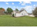 A large lawn surrounds the house with mature landscaping at 110 Oak Wood Ln, Covington, GA 30016