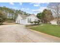 Ranch style home with an attached garage and long driveway at 110 Oak Wood Ln, Covington, GA 30016