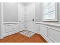 Welcoming entryway featuring hardwood floors, stylish trim, and a double-door closet at 2300 Peachford Rd # 1410, Atlanta, GA 30338