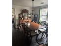 Traditional dining room showcasing a large wooden table and antique buffet, needing TLC at 502 Turner Ave, Palmetto, GA 30268