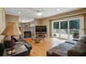 Cozy living room with hardwood floors, fireplace, and french doors to deck at 2612 Arlene Ne Way, Atlanta, GA 30305