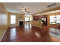 Open-concept living room with hardwood floors, fireplace, and natural light at 1211 Grampian Pass # 15, Marietta, GA 30008