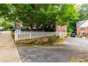 View of the street and the rear corner of the home with a cute picket fence at 830 Barnett Ne St # 8, Atlanta, GA 30306