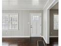 Cozy living room featuring warm hardwood floors, neutral paint, and natural light at 214 Maple St, Atlanta, GA 30354