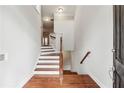 Inviting home entryway with hardwood floors and staircase with wooden handrail at 2959 Rivergreen Se Ln, Atlanta, GA 30339