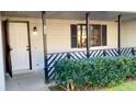 A cozy porch with the house number above the door and well-maintained greenery at 709 Pine Tree Trl # 10A, Atlanta, GA 30349