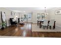 Bright living room with hardwood floors connecting to the dining area, perfect for entertaining at 2151 Zelda Ne Dr, Atlanta, GA 30345