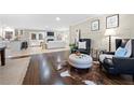 Open-concept living space with hardwood floors and a seamless flow to the kitchen and dining area at 2151 Zelda Ne Dr, Atlanta, GA 30345