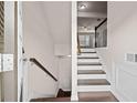 Inviting entryway with hardwood floors and staircase leading to the main living area at 2550 Village Place Dr, Duluth, GA 30096