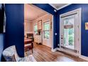 Inviting entryway features stylish blue walls and wood-look floors at 3157 Oakdale Rd, Hapeville, GA 30354