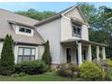 Charming two-story home boasts manicured landscaping and architectural details at 3157 Oakdale Rd, Hapeville, GA 30354