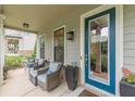 Inviting front porch featuring cozy seating, creating an ideal space to unwind and enjoy the outdoors at 3157 Oakdale Rd, Hapeville, GA 30354