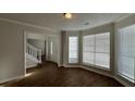 Welcoming entryway with hardwood floors, staircase, and ample natural light at 3713 Cameron Hills Pl, Ellenwood, GA 30294