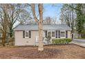 Well-maintained home with a tidy front yard, complemented by a concrete driveway at 1438 Joy Ln, Decatur, GA 30032