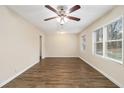 Bright and airy living room with hardwood floors, neutral walls, and a ceiling fan at 1438 Joy Ln, Decatur, GA 30032