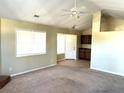 Bright living room features neutral walls, carpeted floors, and ceiling fan at 3611 Spring Pt, Decatur, GA 30034