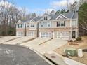 Well-manicured townhomes with individual driveways, and attached two-car garages for residents at 96 Trailview Lane Ln, Hiram, GA 30141