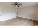 Clean and bright room features new floors, neutral wall colors, and a ceiling fan at 4624 College St, Forest Park, GA 30297