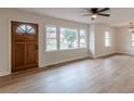 Bright living room with modern flooring, neutral walls, and updated lighting at 4624 College St, Forest Park, GA 30297