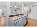 Kitchen with stainless steel appliances, granite countertops, and hardwood floors at 507 Ridge View Xing, Woodstock, GA 30188