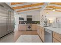 Modern kitchen with stainless steel appliances, custom cabinets, and stylish backsplash at 2111 Drew Valley Ne Rd, Brookhaven, GA 30319