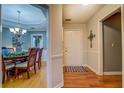Inviting foyer showcasing hardwood floors and a glimpse into the dining room at 3496 Honeycomb Dr, Conyers, GA 30094